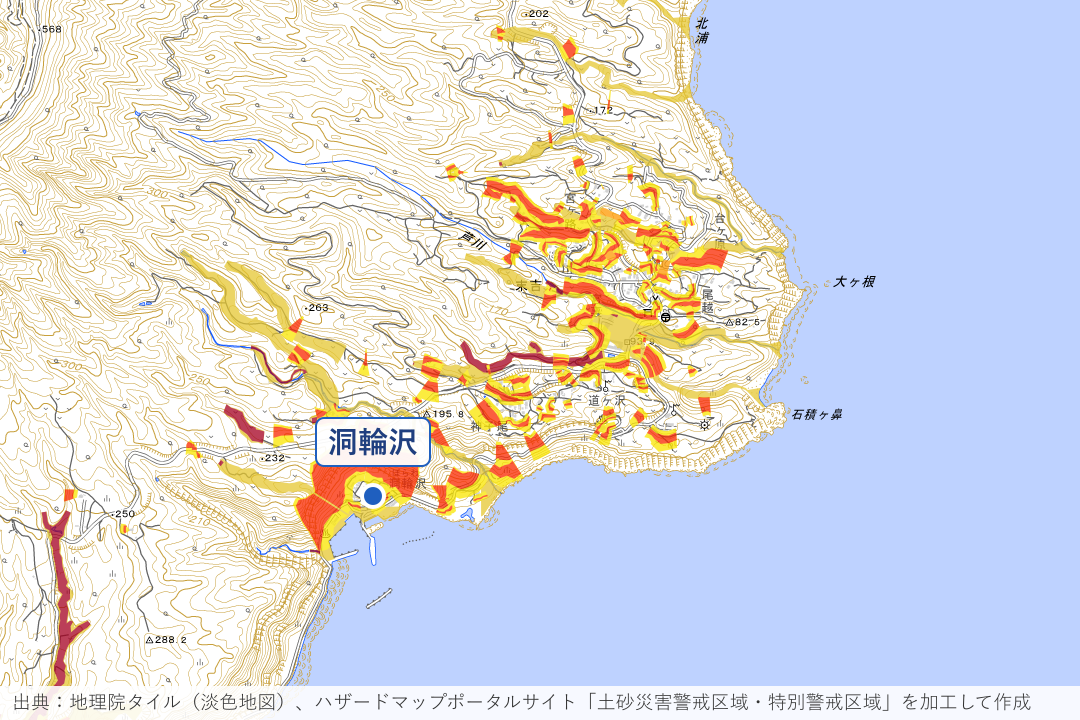 末吉の集落と洞輪沢漁港周辺の土砂災害警戒区域を重ねた地図